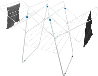 A white foldable drying rack with two towels draped over it.