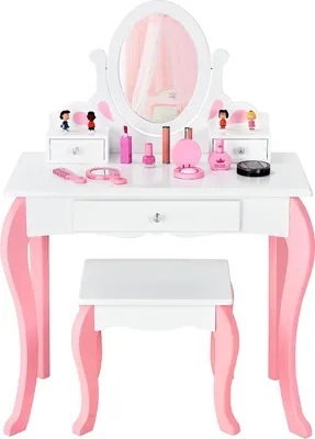 A white and pink wooden children's vanity table with a stool and pretend makeup accessories.