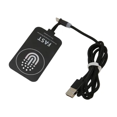 A black wireless charging receiver with a USB cable is shown on a white background.