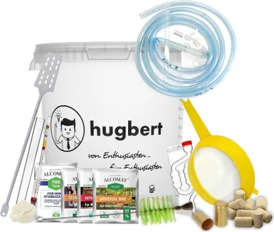 A collection of items for winemaking, including a large fermentation bucket, tubing, a funnel, a hydrometer, a stirrer, brushes, and packets of ingredients.