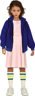 A young girl wearing a pink dress, blue jacket, and striped socks.