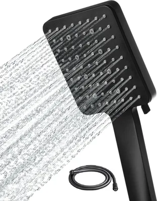 A black shower head with water spraying from it, and a coiled black shower hose below.