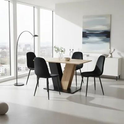 A dining set with a table and four chairs in a modern dining room with large windows.