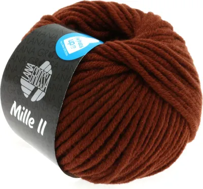 A ball of brown yarn with a label wrapped around it.
