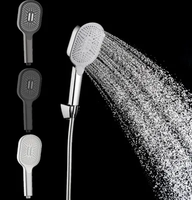 A shower head spraying water, with three different colored shower heads shown on the left.