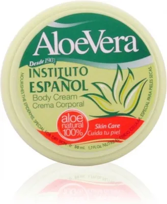 A close-up of a round container of Aloe Vera body cream.
