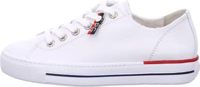 A side view of a white leather sneaker.