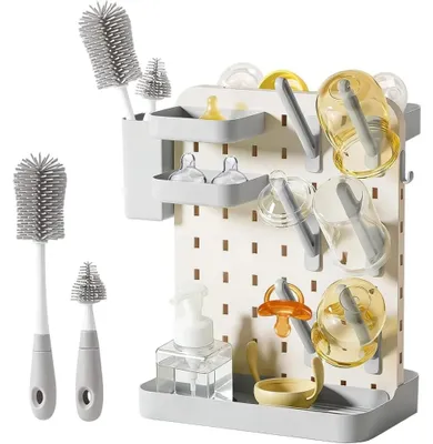 Immagine prodotto di Portabottiglie verticale per biberon, con vaschetta di raccolta e contenitore per tettine, realizzato in plastica PP