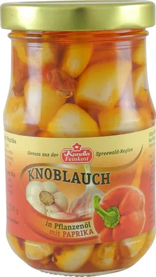 Produktbild von Knoblauchzehen in Öl mit Paprika von Kunella Feinkost (185 g Glas)