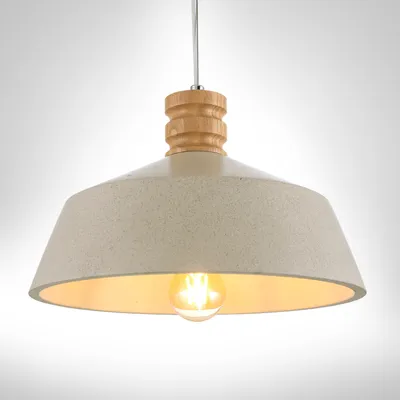 A pendant light fixture with a beige, speckled shade and a wooden accent at the top, suspended against a plain background.