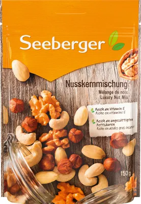 Produktbild von Seeberger 12949, Gemischte Nüsse, 150 g, Milchzucker, Nusskernmischung in veränderlichen Gewichtsanteilen (HASELNUSSKERNE, blanchierte MANDELN,..., 643 kcal, 193 kcal
