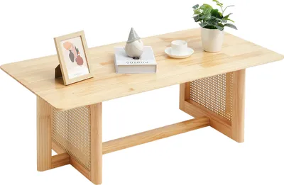 A wooden coffee table with decorative items on top.