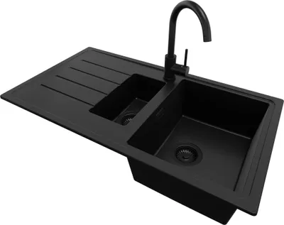 A black double basin kitchen sink with a black faucet, shown from a slightly elevated diagonal angle against a white background.