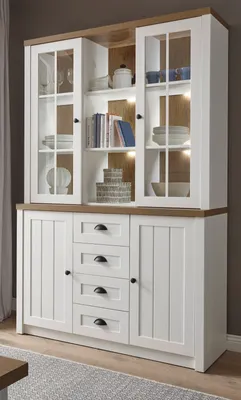 A white and light oak buffet cabinet with glass doors and drawers.