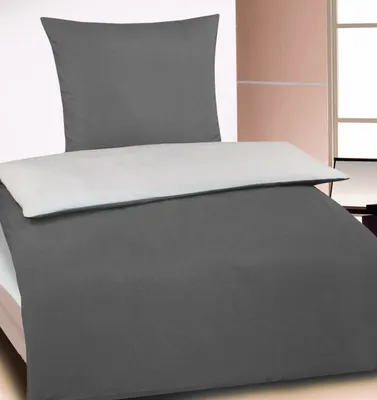 A bed with a duvet cover and pillowcase.