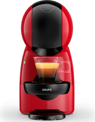 A red and black coffee machine with a glass of coffee.
