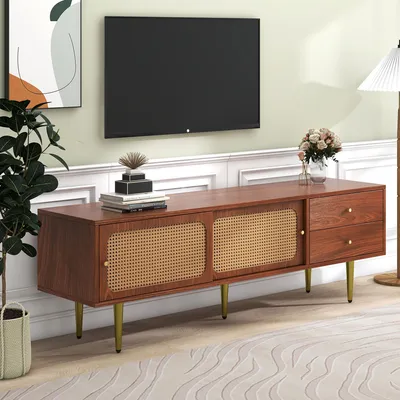 A living room scene featuring a TV stand with a television mounted above it.