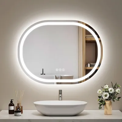 A modern bathroom vanity with a sink, faucet, and an illuminated oval mirror.