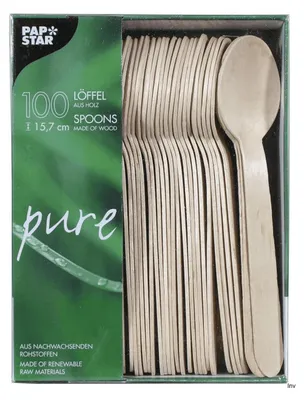 A box of wooden spoons with green packaging.