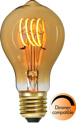 A close-up studio shot of an amber-colored LED light bulb with a spiral filament, set against a white background. A circular graphic indicating dimmer compatibility is visible in the lower right corner.