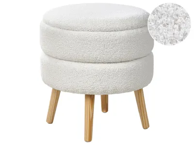 A white bouclé ottoman with wooden legs against a white background.