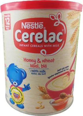 A can of Nestle Cerelac infant cereal with honey and wheat flavor.