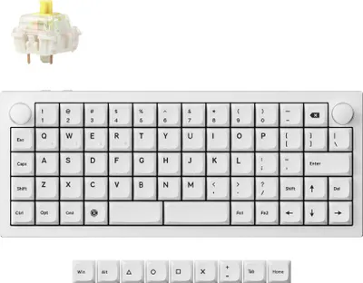 A white mechanical keyboard and a single keyboard switch are displayed against a white background.