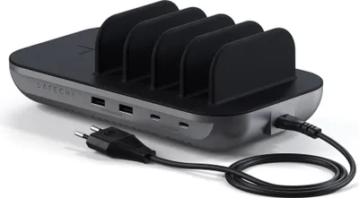 A Satechi charging station with multiple slots and ports, connected to a power cable.