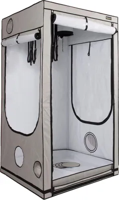 An empty grow tent with its door open, showing the interior and some of its features.