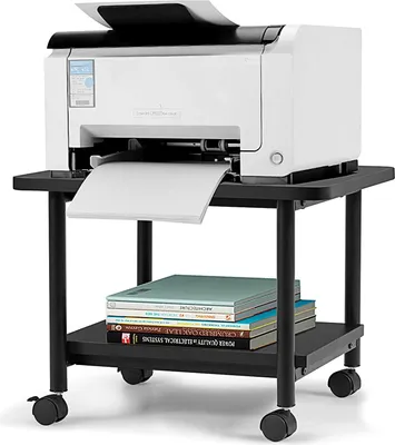 A white printer sits on a black two-tier rolling stand. Books are stacked on the bottom tier.