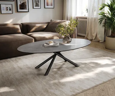 Produktbild von DELIFE Couchtisch Edge Oval 140x80 cm Keramik Beton Grau Sarity Metall Schwarz