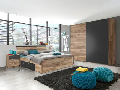A modern bedroom with a bed, nightstand, and wardrobe.