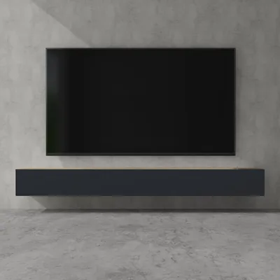 A modern TV stand mounted on a concrete wall with a television on top.