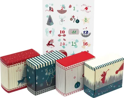 Four small decorative boxes and a sheet of stickers with numbers and Christmas motifs.