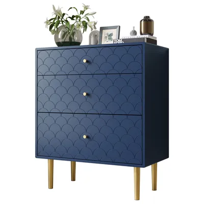 A navy blue dresser with gold legs and decorative drawer fronts is shown against a white background. Decorative items are placed on top of the dresser.