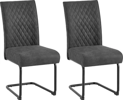 Two dark gray dining chairs with quilted seats and backs, and black metal frames, are shown against a white background.
