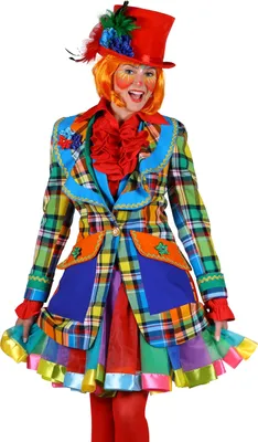 A woman dressed in a colorful clown costume, including a hat, jacket, and skirt, posing against a white background.