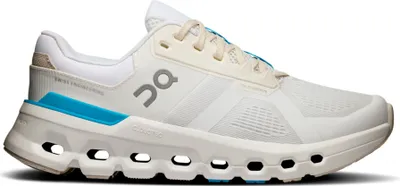 A studio shot of a single white and beige running shoe with blue accents.