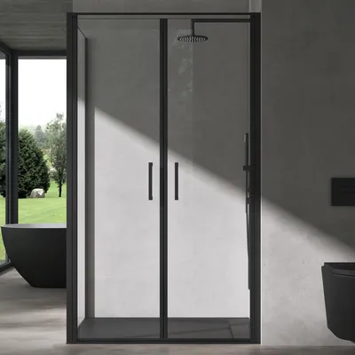 A modern bathroom with a black shower cabin and a black bathtub visible through a large window.