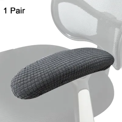 Close-up of a grey armchair armrest cover on a chair.
