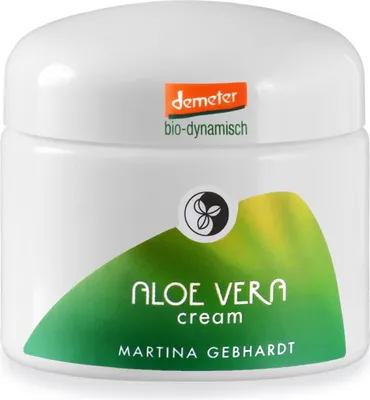 A white jar of Martina Gebhardt Aloe Vera cream with green and yellow branding.