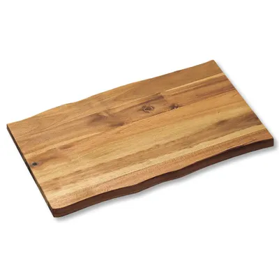 A wooden cutting board with a live edge.
