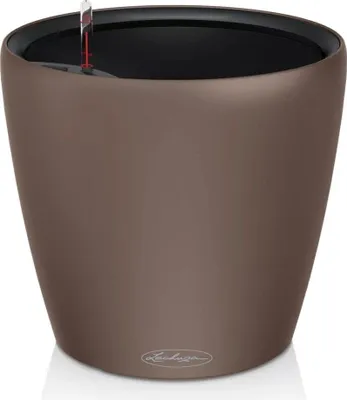 A brown planter with a self-watering system.