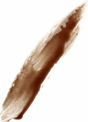 A swatch of brown cosmetic product on a white background.