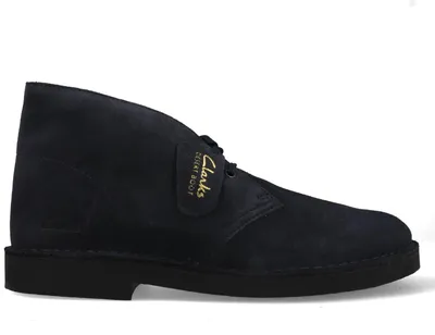 A single dark blue Clarks desert boot is shown against a white background.