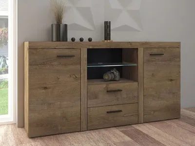 A wooden sideboard with drawers and cabinets, displayed in a room setting.