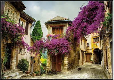 Produktbild von Wallario Wandbild Malerische Stadt in der Provence mit bunten Blumen, Größe: 70,30 x 100,30 cm, Poster mit schwarzem Aluminiumrahmen