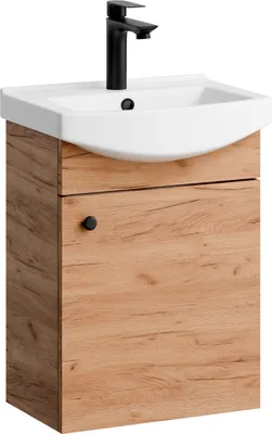 A white sink with a black faucet is mounted on a wooden cabinet with a single black knob.