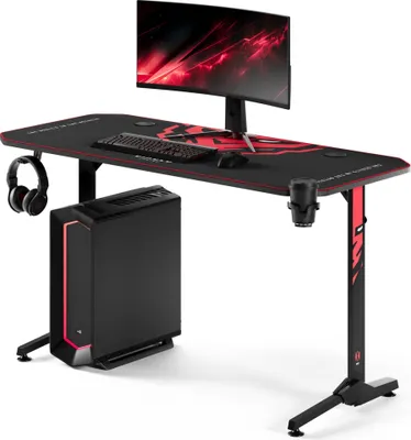 A gaming desk setup with a computer tower, monitor, keyboard, mouse, and headphones.