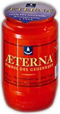 A red jar with a label.